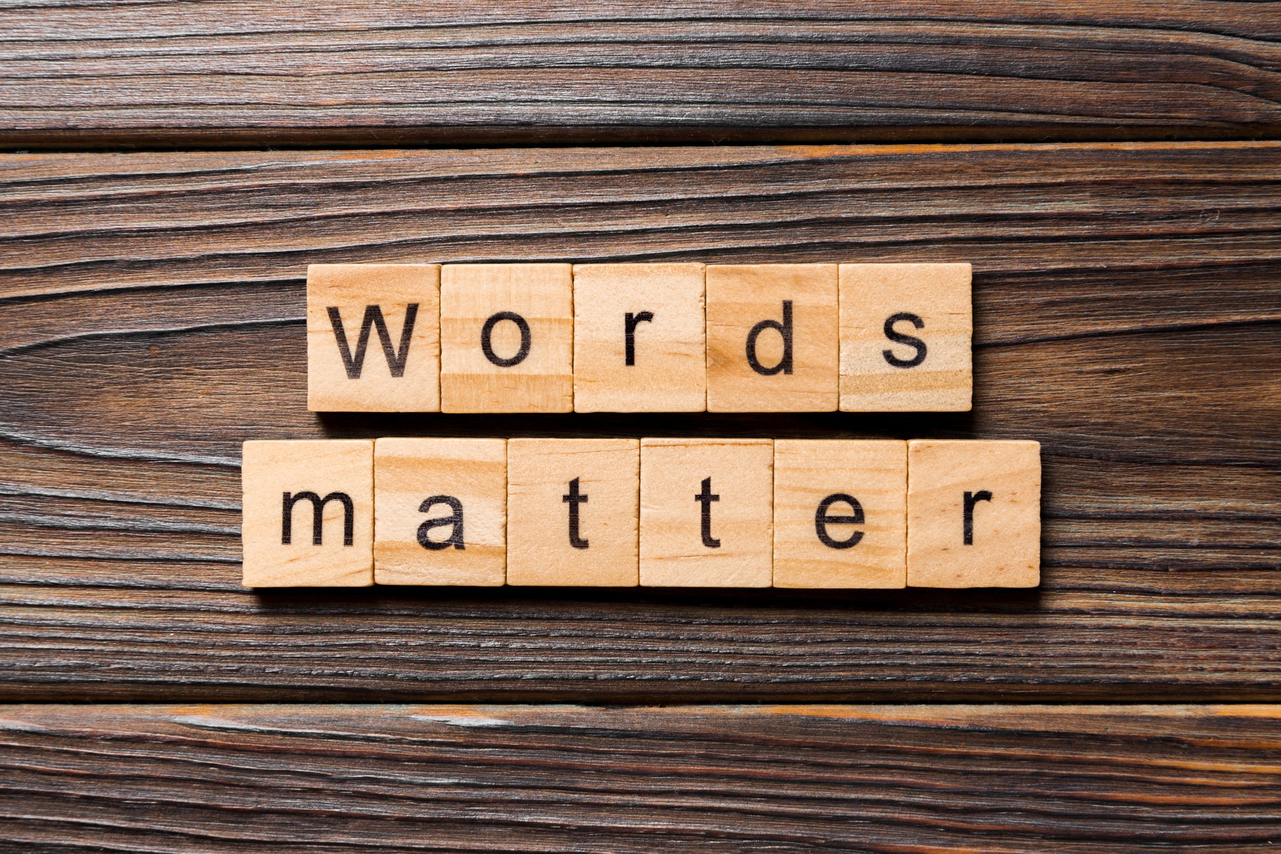 "Words matter" on wood block. Words matters text on table